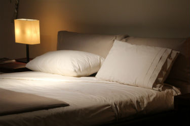 A close up picture of the Hotel Sheets Direct on a queen bed